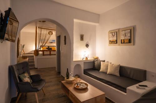 a living room with a couch and a table at Little Garden in Pera Gyalos