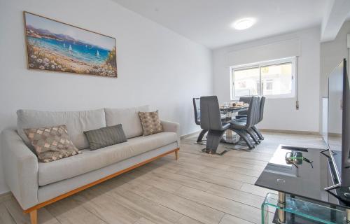 a living room with a couch and a table at The Chairs Place GuestHouse in Lagos