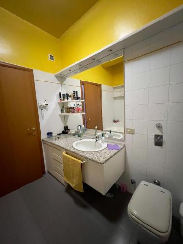 a bathroom with a sink and a toilet at private room in Seveso