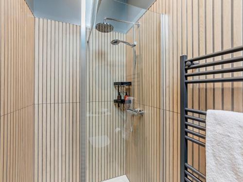 a shower with a glass door in a bathroom at 2 Bed in Carlisle oc-96302 in Scaleby