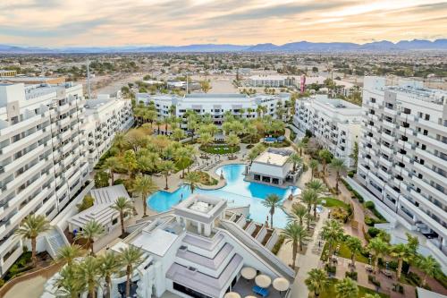 an aerial view of a resort with a pool and palm trees at Hilton Vacation Club Cancun Resort Las Vegas in Las Vegas