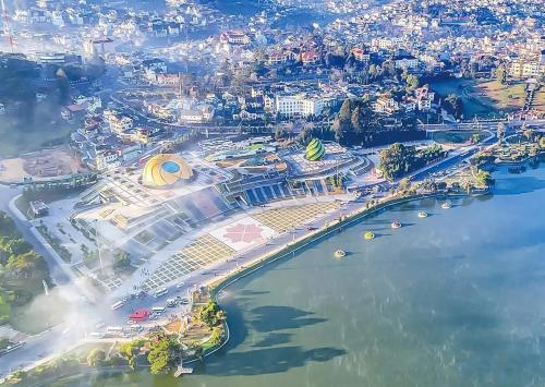 an aerial view of a city next to the water at holtel Tâm An in Da Lat