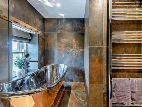 a bathroom with a sink and a mirror at 1 Bed in Carlisle oc-94538 in Scaleby