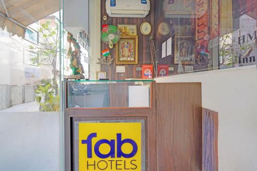 a toro hotels sign on the door of a store at FabHotel HM Inn in Lucknow