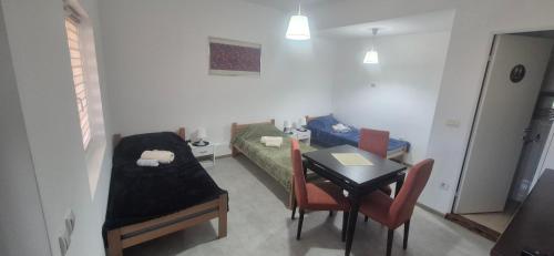 a living room with a couch and a table at Odmorište Noćko in Valjevo