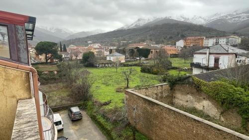 a view from a balcony of a city with mountains at El Mirador de Hervas in Hervás