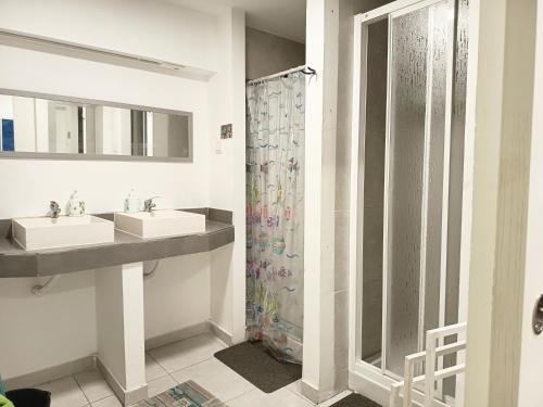 a bathroom with two sinks and a shower at Alfonso XII in Redondela