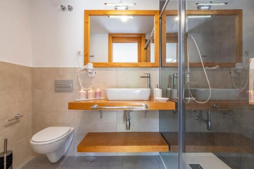 a bathroom with a sink and a toilet at GC0284 El Granero in Mogán