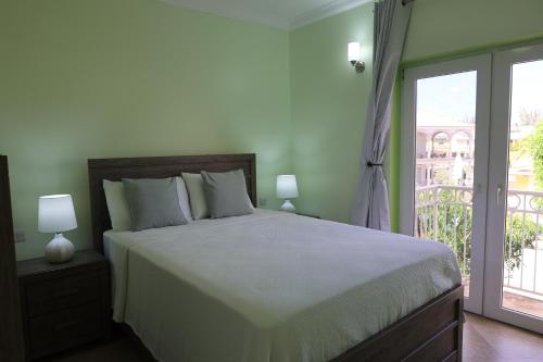 Llit o llits en una habitació de Condo Del Triple Vista