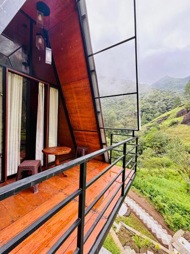 a view from the balcony of a house on a mountain at Bambarakanda eco resort in Welegama