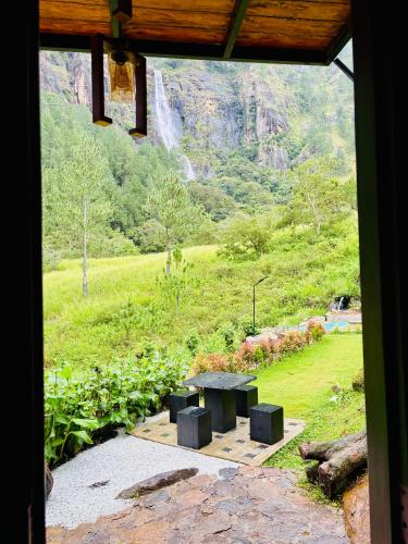 a view of a picnic table from a window at Bambarakanda eco resort in Welegama