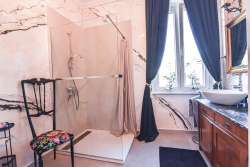 a bathroom with a shower and a sink at Lovran deluxe apartman in Lovran
