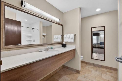 a bathroom with a sink and a large mirror at Best Western Timpanogos Inn in Lehi