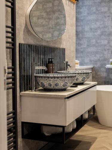 a bathroom with a sink and a mirror at Hunday Manor Country House Hotel in Workington