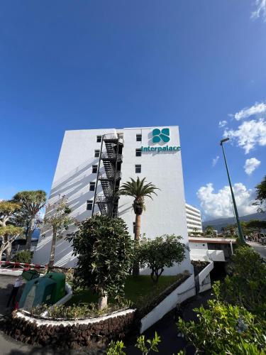 a building with a sign on the side of it at BLUESEA Interpalace in Puerto de la Cruz