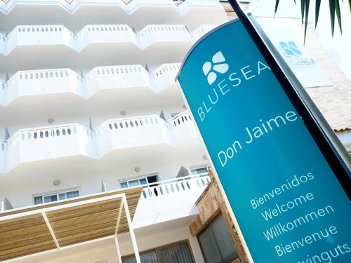 a sign for a hotel in front of a building at BLUESEA Don Jaime in Cala Millor