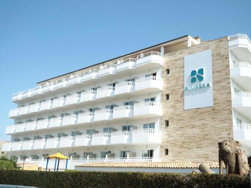 a hotel with a sign on the side of it at BLUESEA Don Jaime in Cala Millor