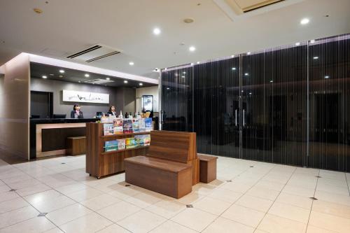 a pharmacy lobby with a pharmacyacist in the background at Hotel Sardonyx Ueno in Tokyo
