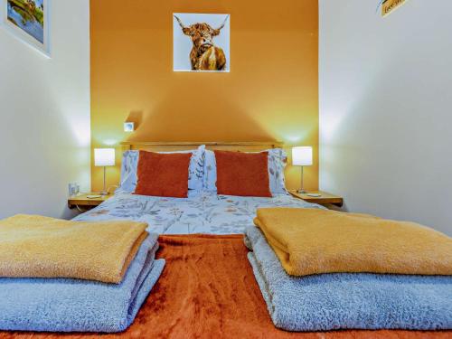a bedroom with a large bed with two pillows at 1 Bed in Llangammarch Wells oc-bn216 in Garth