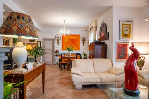a living room with a couch and a table at L'Elisea Maison De Charme in Castellabate