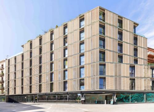 a large brick building on a city street at Hotel Rec Barcelona - Adults Only in Barcelona