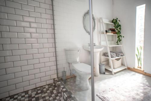 a bathroom with a toilet and a sink at Parmant in Robertson