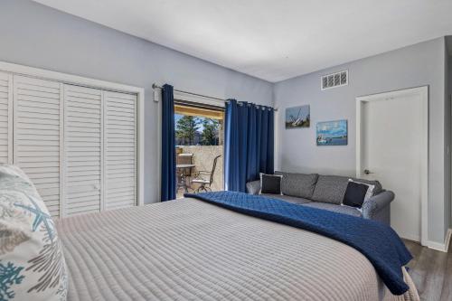 a bedroom with a bed and a couch at 201 Captains Quarters in Hilton Head Island