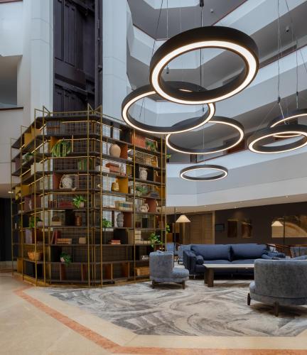 a lobby with a large chandelier in a building at Cosmos 100 Hotel & Centro de Convenciones - Hoteles Cosmos in Bogotá