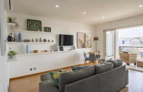 a living room with a couch and a tv at B19 - Marina Club Apartment in Lagos