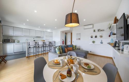a kitchen and living room with a table and chairs at B19 - Marina Club Apartment in Lagos