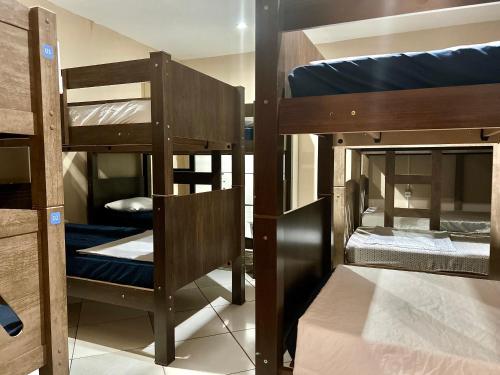 a group of bunk beds in a room at Hostel Mar in São Luís