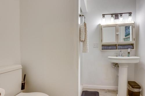a bathroom with a toilet and a sink at Pool Table & Shared Sauna! Potomac River Basecamp in Westernport