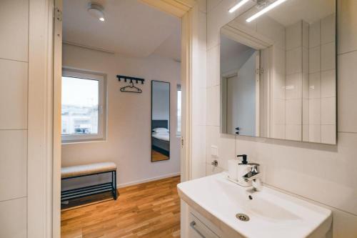 a bathroom with a sink and a mirror at Edsviken Hotell in Stockholm