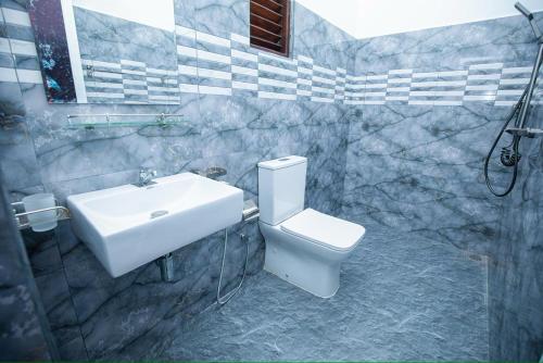 a bathroom with a sink and a toilet at Yala Lemon View in Tissamaharama