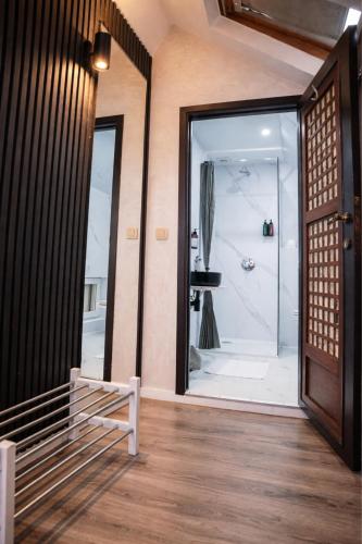 a bathroom with a shower and a glass door at Hotel Le Centenaire Brussels Expo in Brussels