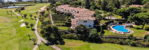an aerial view of a house with a swimming pool at Formosa Villas in Quinta do Lago