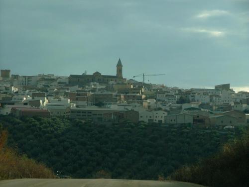 a view of a city with a town on a hill at Hospedería Ana Pilar in Porcuna