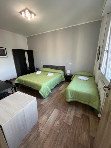 GioiaHomes tesisinde bir odada yatak veya yataklar