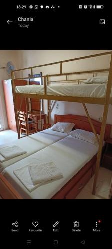 two bunk beds in a room with a window at Constantinos Budget Beds in Chania