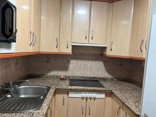 a kitchen with a sink and a counter top at Cortijo rural Los Pinos in Villanueva de Algaidas