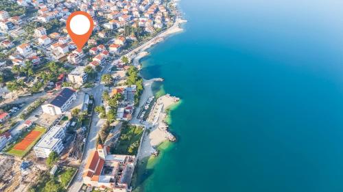 an aerial view of a river with a red marker at House Marija in Trogir