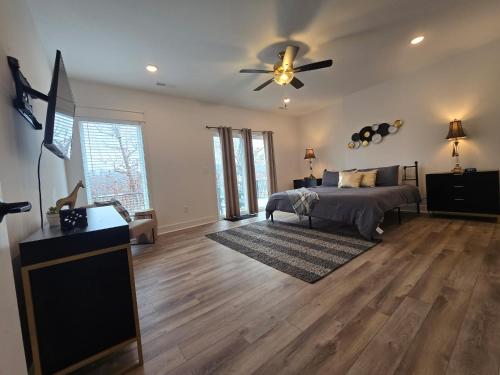 a bedroom with a bed and a ceiling fan at Waterfront Retreat One in Rocky Mount