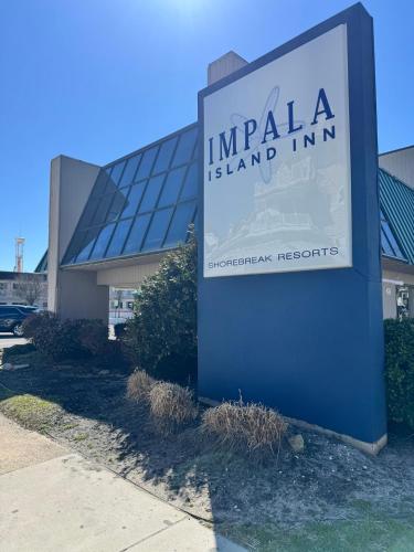 a sign for an india island inn in front of a building at Impala Island Inn in Ocean City
