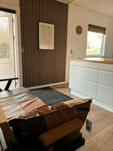 a room with a bed and a window in it at Oasen in Nørresundby