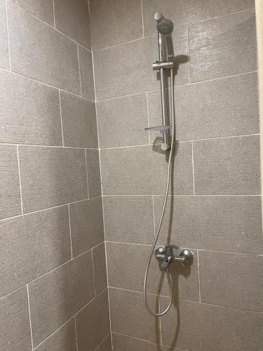 a shower with a shower head in a bathroom at vip ghazala in Dahab