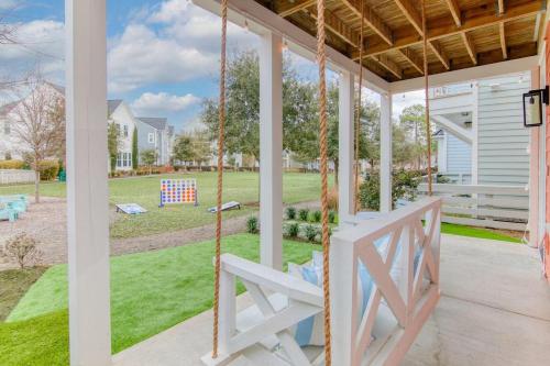 a porch swing with a view of a yard at Happy Ours, Mins to Park Circle, Dtwn, CHS Beach in Charleston
