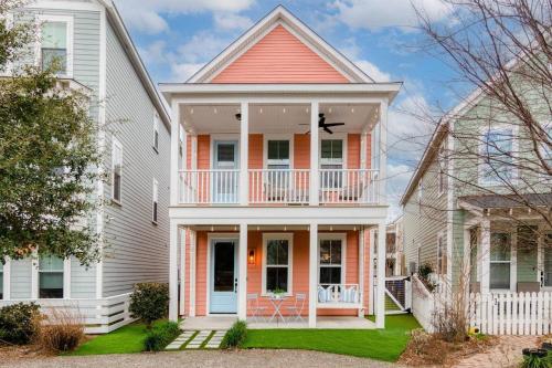 a white house with a red roof at Happy Ours, Mins to Park Circle, Dtwn, CHS Beach in Charleston