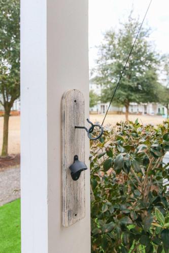 a bird feeder hanging on a house at Happy Ours, Mins to Park Circle, Dtwn, CHS Beach in Charleston