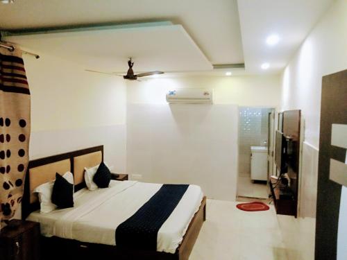 a bedroom with a bed in a room at Hotel Alpine in Chandīgarh