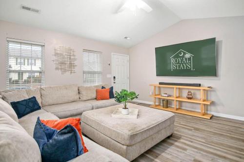 a living room with a couch and a table at The Suite Carolinas in Charleston